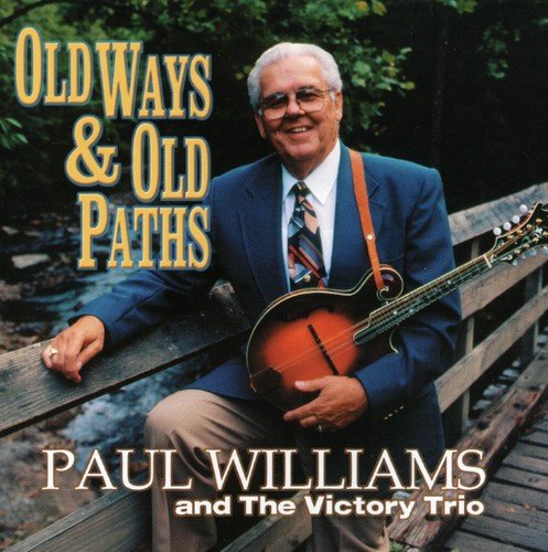 "Album cover with man holding mandolin on a wooden bridge, outdoors."