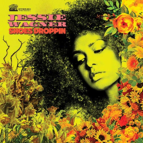 Vinyl album cover with a woman surrounded by flowers and foliage, yellow background.