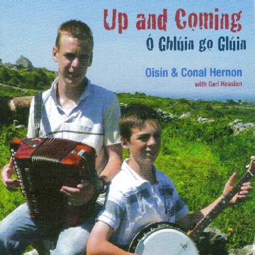 "CD cover featuring two men playing accordion and banjo outdoors."