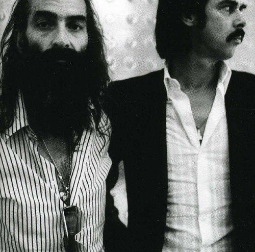 A CD case with a black cover, titled "White Lunar" by Nick Cave and Warren Ellis.