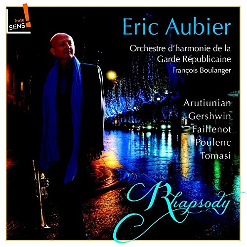 CD cover featuring a man in blue, city lights, and musical composers’ names.