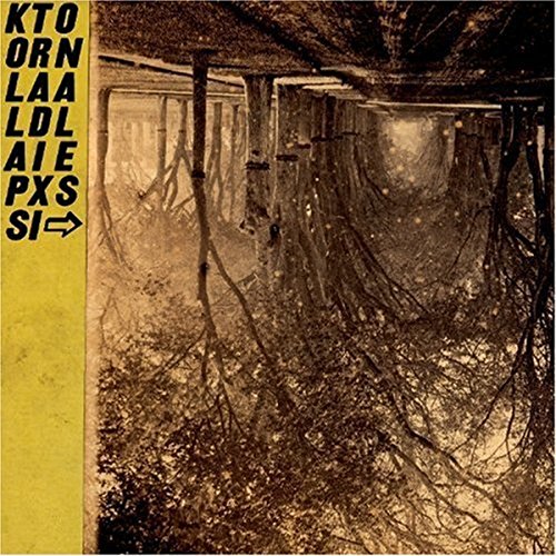 CD cover: decaying wooden structure amidst tangled roots, yellow text.