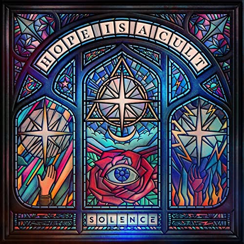 Stained glass artwork featuring a central rose with an eye, stars, and geometric patterns.