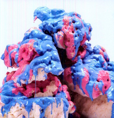 Blue and pink abstract sculpture resembling dripping, porous forms.