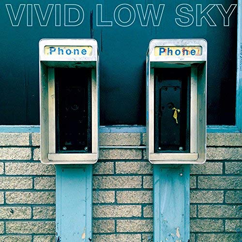 "Album cover featuring two old phone booths against a brick wall."
