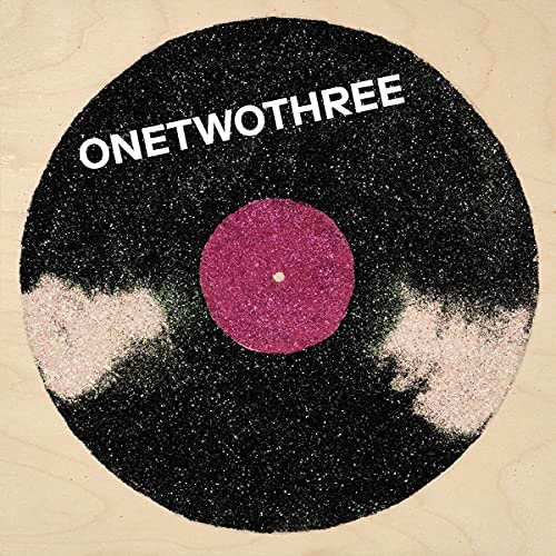 Black record with pink center and white text reading "ONETWOTHREE".