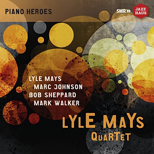 "Lyle Mays Quartet CD cover featuring abstract orange and yellow circles on a dark background."