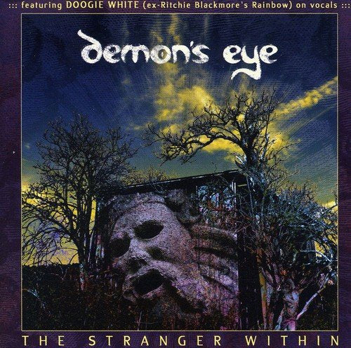 "Album cover art: 'Demon's Eye' with a stone face and dark trees."