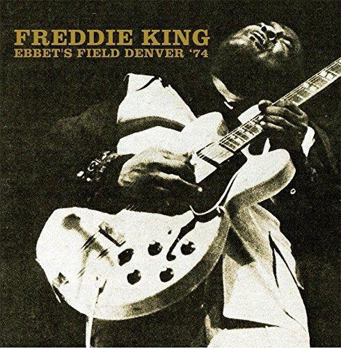 Freddie King playing a white electric guitar, sepia-toned album cover.
