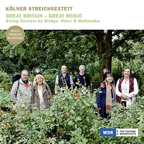 "CD cover with six musicians standing in a lush, green garden."