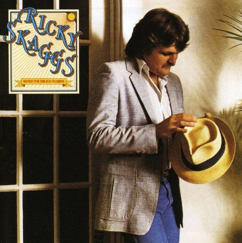 "Ricky Skaggs album cover with man in light jacket holding hat, standing by window."
