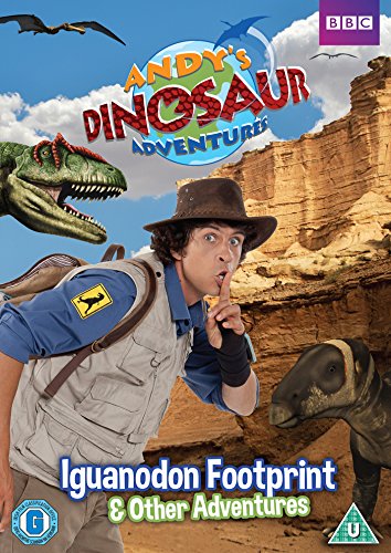 Andy in a safari hat with dinosaurs in a rocky landscape on DVD cover.
