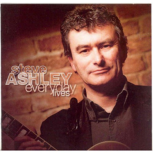 "Album cover featuring Steve Ashley holding a guitar, with brick wall background."