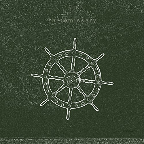 Dark green vinyl record cover with a white ship's wheel illustration and "The emissary" text.