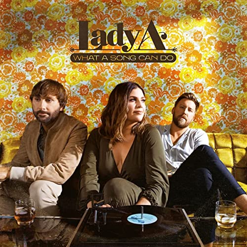 Lady A album cover with band members and a record player.