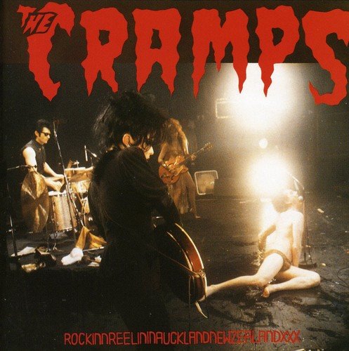Album cover of "The Cramps" with a band performing on stage.