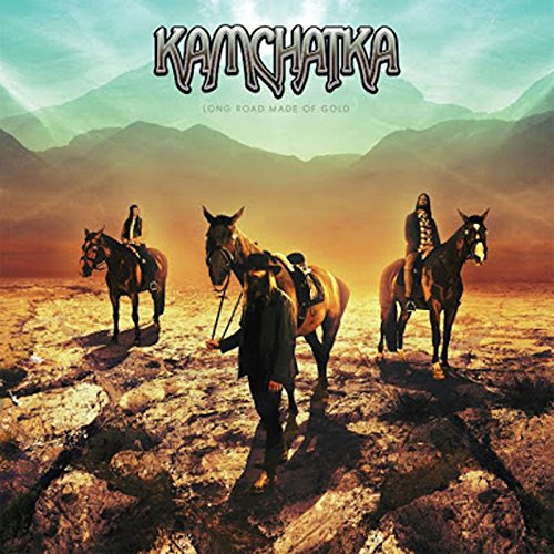 "Album cover with three horse riders in a rocky landscape, mountains in the background."