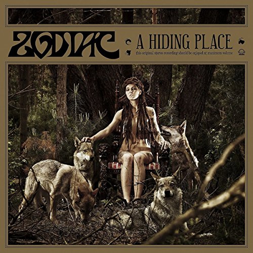 CD cover: woman with wolves in a dark, wooded setting.