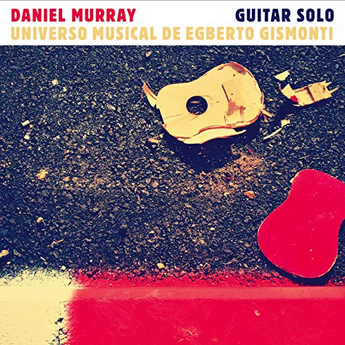 "Album cover with broken guitar on asphalt, colorful abstract design, and artist's name displayed."