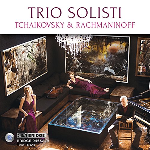 CD cover featuring a man and two women in a dark, artistic room.