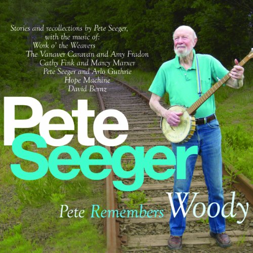Pete Seeger album cover featuring him with a banjo on railroad tracks.