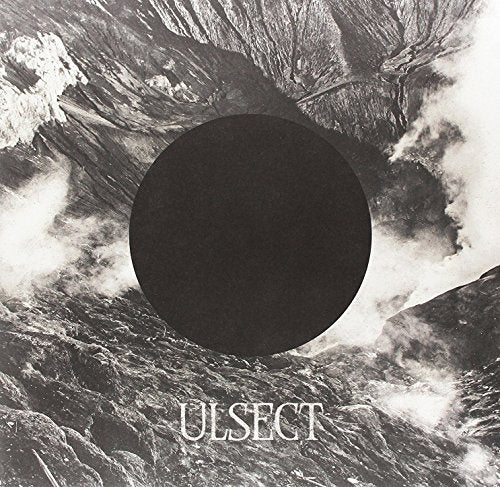 Dark album cover with a black circle and textured, cloudy landscape.