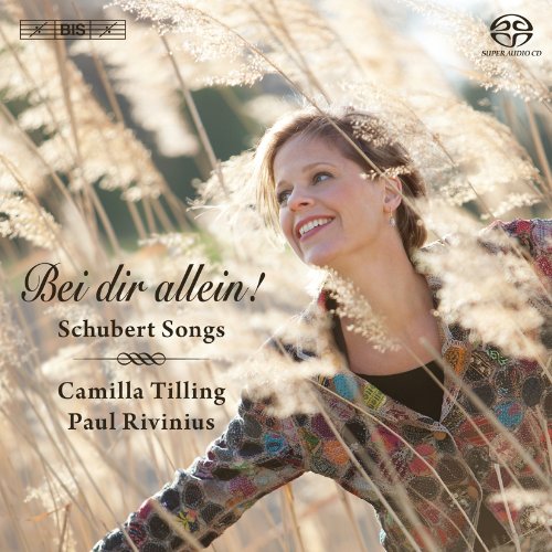 CD cover featuring a smiling woman amidst golden wheat fields.