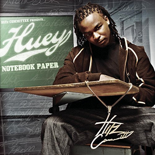 "Album cover featuring a man sitting with a clipboard and chain, against a chalkboard background."