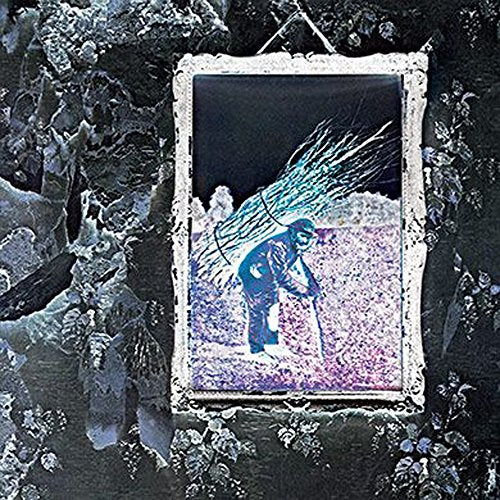 "Led Zeppelin IV album cover with man carrying sticks on a worn wall."