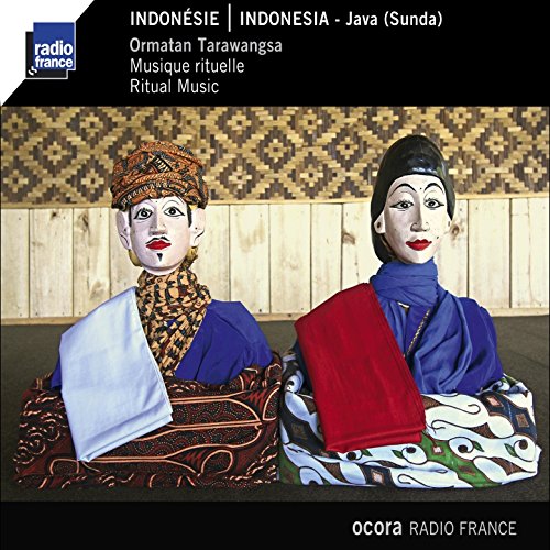 Two traditional Indonesian puppets wearing colorful textilesBatik clothing and headgear.