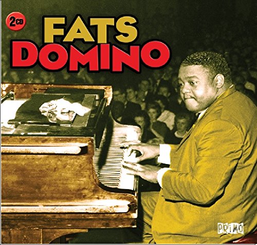 "Fats Domino album cover featuring a man playing piano for an audience."