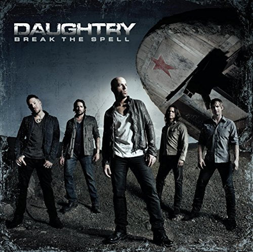 "CD cover art: five men standing in front of a crashed airplane with a red star."