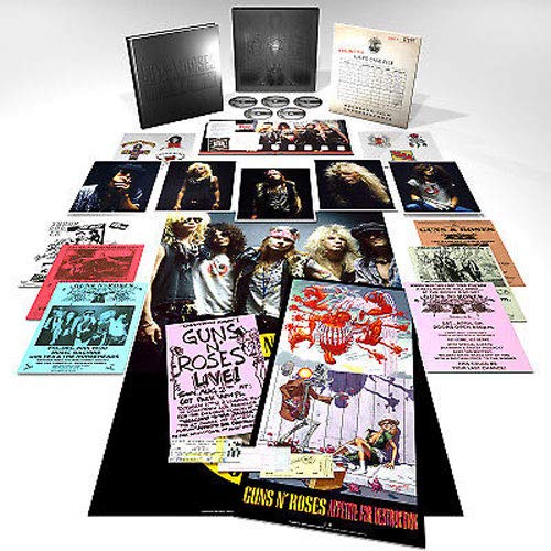 "Guns N' Roses CD box set with various inserts and promotional materials displayed."