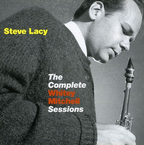 "Album cover with a man holding a saxophone, head bowed, in black and white."