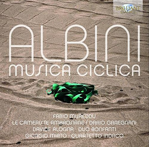 "CD cover with 'ALBINI MUSICA CICLICA' text, green ribbon on sandy background."