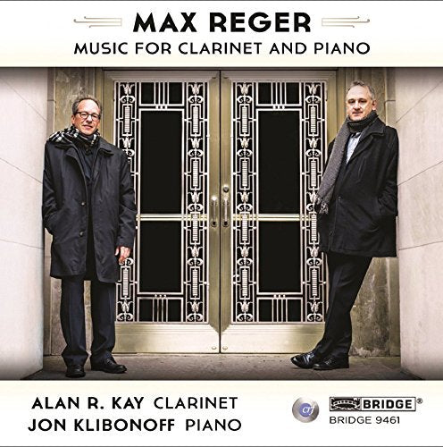 CD cover featuring two men standing by ornate doors, with text and logo.
