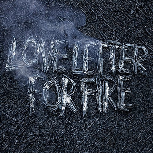 Album cover: “Love Letter For Fire” title formed from twigs on dark ground.