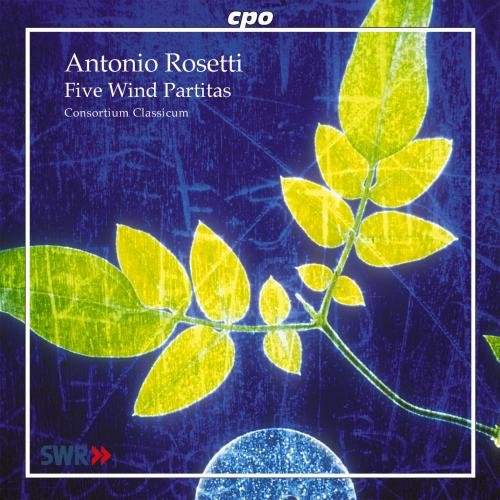A CD cover featuring a blue background with a yellow-green plant and white text.