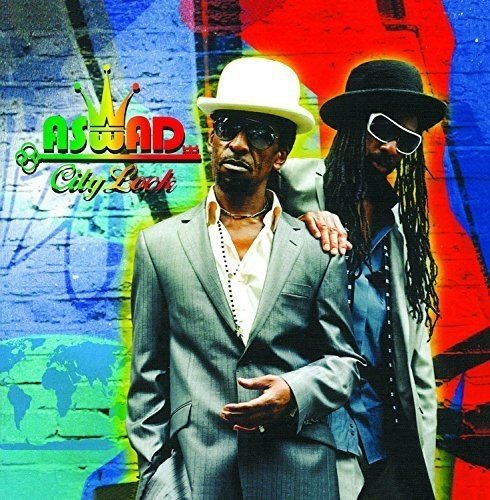 "Album cover featuring two men in suits and hats against a colorful background."