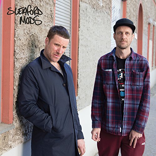 Two men stand against a textured wall, album title "Sleaford Mods" above.