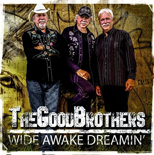"Album cover featuring three men standing in front of a graffiti wall."
