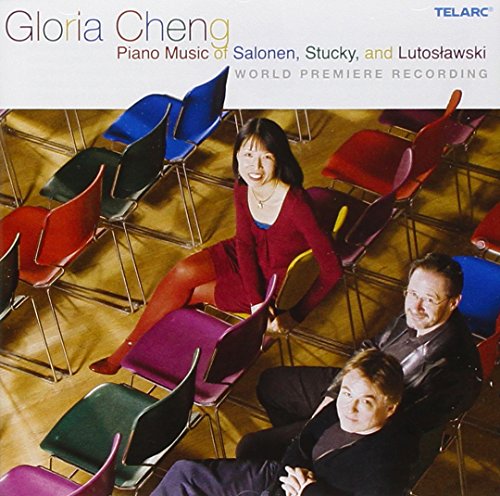 CD cover with a woman and two men sitting among colorful chairs.
