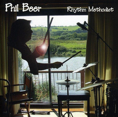 "CD cover featuring a silhouette of a man playing drums by a window."