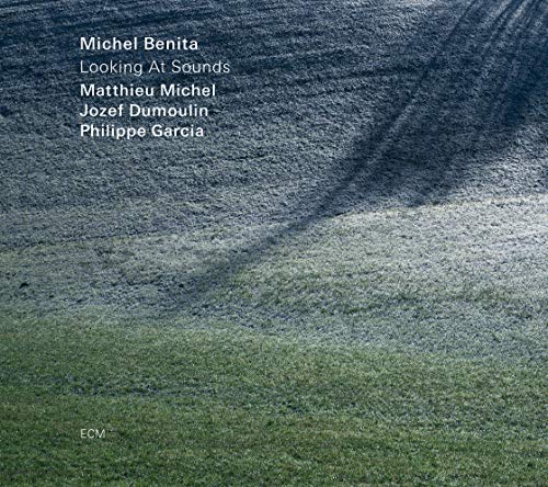 "Album cover with grassy field and shadow, featuring white text listing artist and musicians."