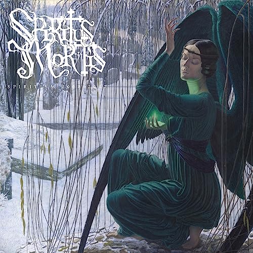 CD cover: woman in green kneeling with glowing hands in a snowy landscape.