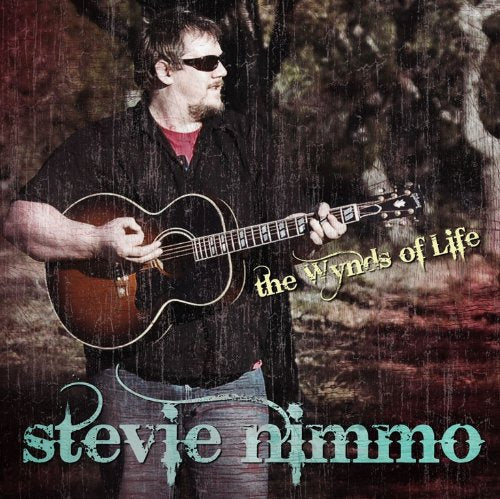 Man with guitar, album cover for “The Wynds Of Life” by Stevie Nimmo.