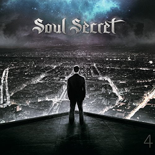 CD cover: Silhouette of a man overlooking a brightly lit cityscape.