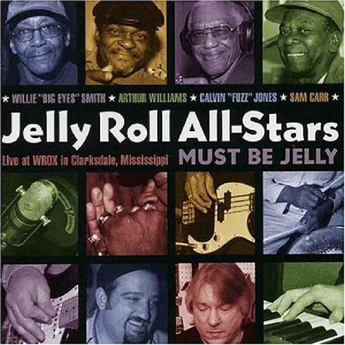 "CD cover with a grid of 12 musician photos and text."