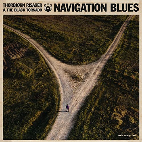 CD cover: a lone figure stands at a three-way dirt road split.