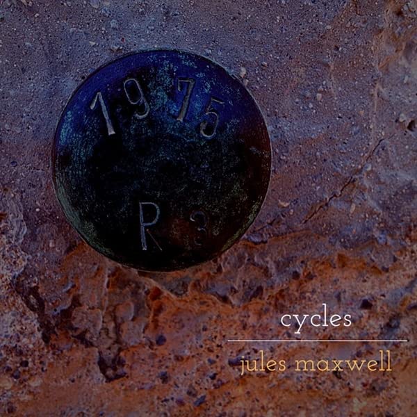 Vinyl record with "1975" and "cycles" text on a textured surface.